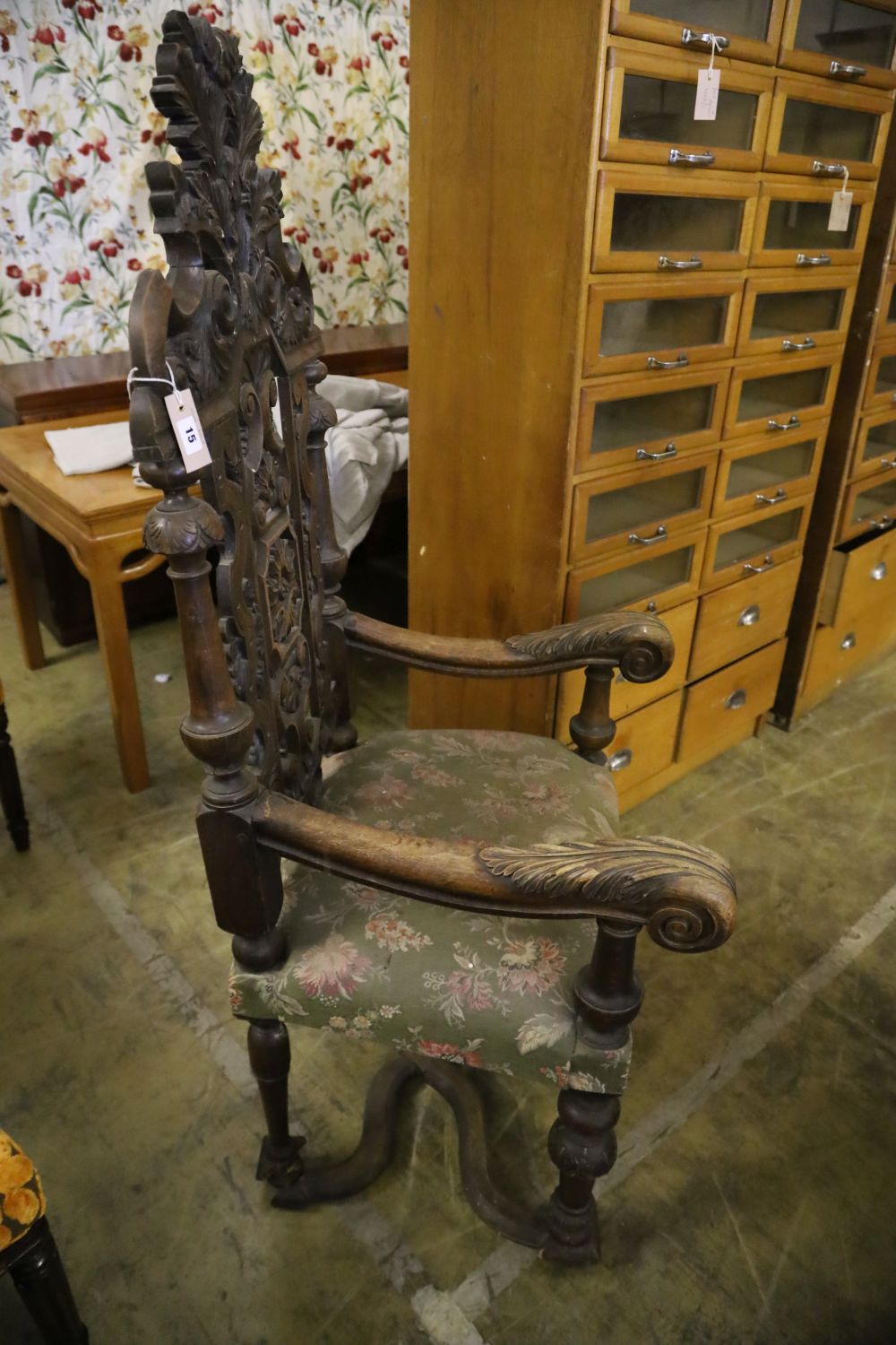 A late 19th century Flemish carved oak elbow chair, width 88cm height 150cm